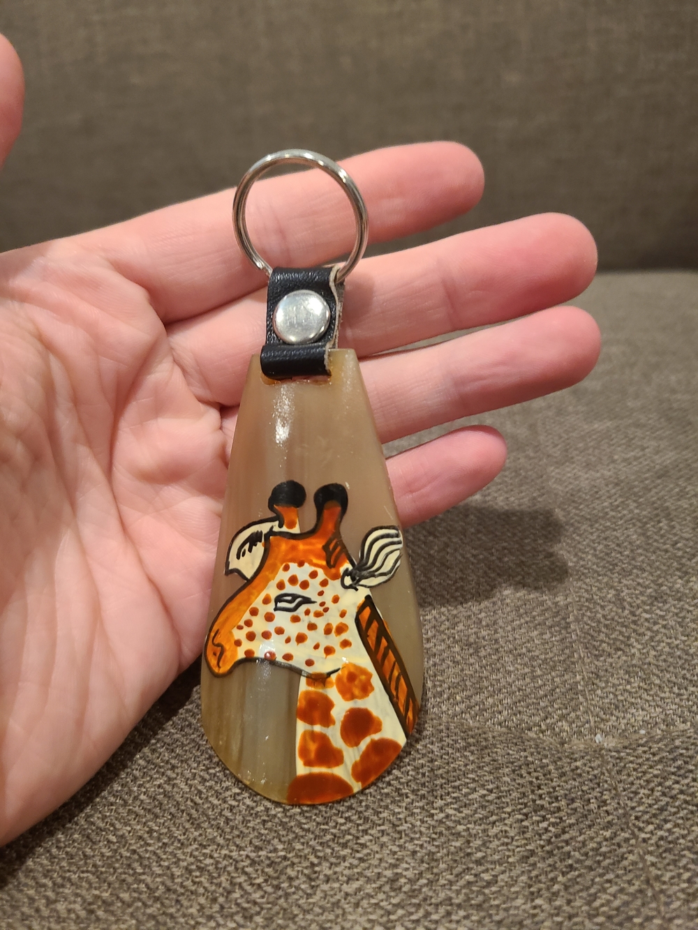 African animal horn keychain features a hand-painted giraffe motif